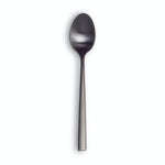 Modern, minimalist matte black spoon on white background.