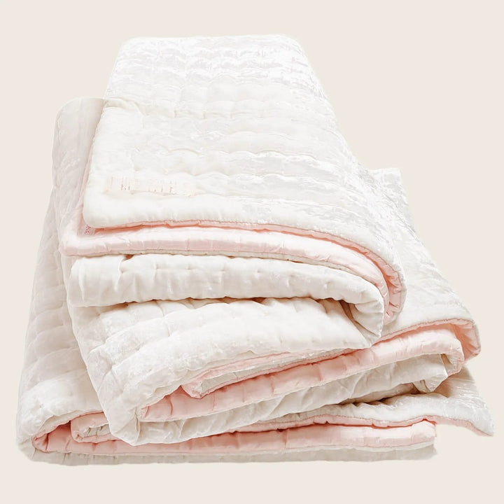 Soft and plush quilt with a line and curve design.