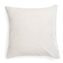 Plain white pillow with a soft texture, creating a monochromatic look.