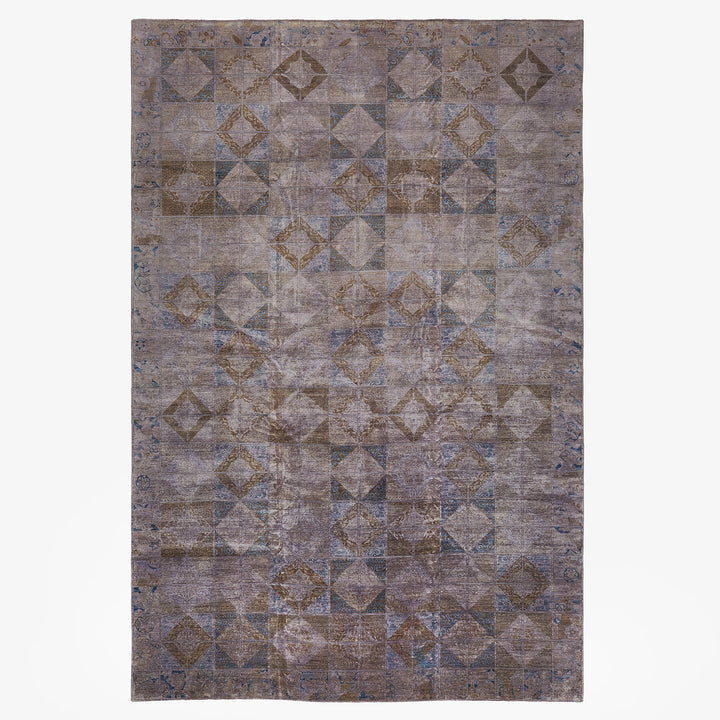 Vintage-inspired rug with geometric design in muted tones, perfect for multiple interior styles.