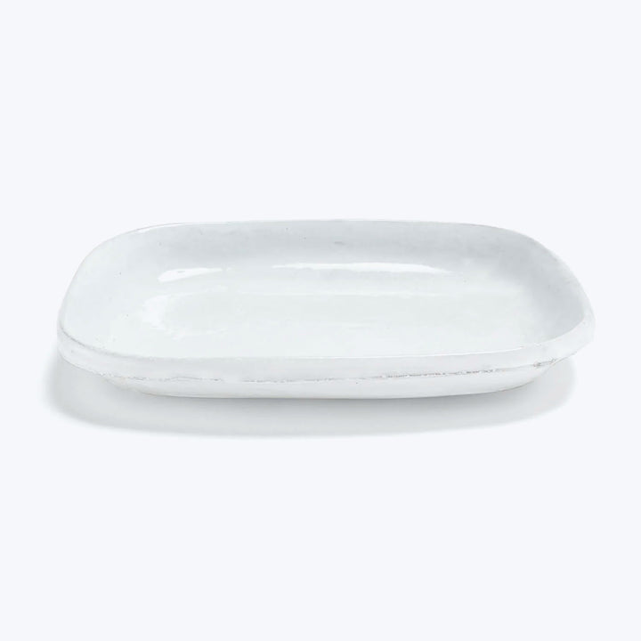 White ceramic platter with raised edges for serving small dishes
