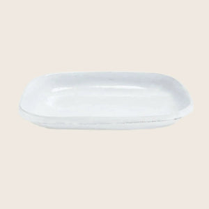 White ceramic platter with raised edges for serving small dishes