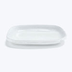 White ceramic platter with raised edges for serving small dishes