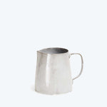 Simple, metallic pitcher with utilitarian design on plain white background.