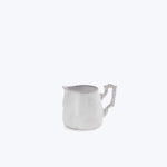 Small silver pitcher with spout against white background, matte finish.
