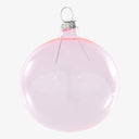 Translucent pink Christmas ornament with silver cap against white background.