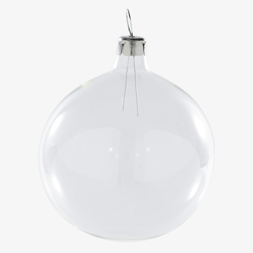 Clear glass incandescent light bulb on white background, conventional shape.