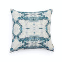 Abstract blue and gray decorative pillow with symmetrical marbled design.