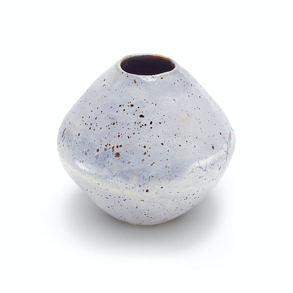Hand-crafted ceramic vase with a rustic, speckled appearance on white background.
