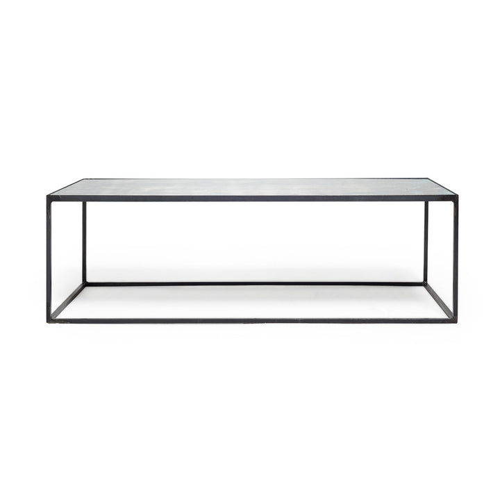 Modern, minimalist coffee table with metal frame and sleek design.
