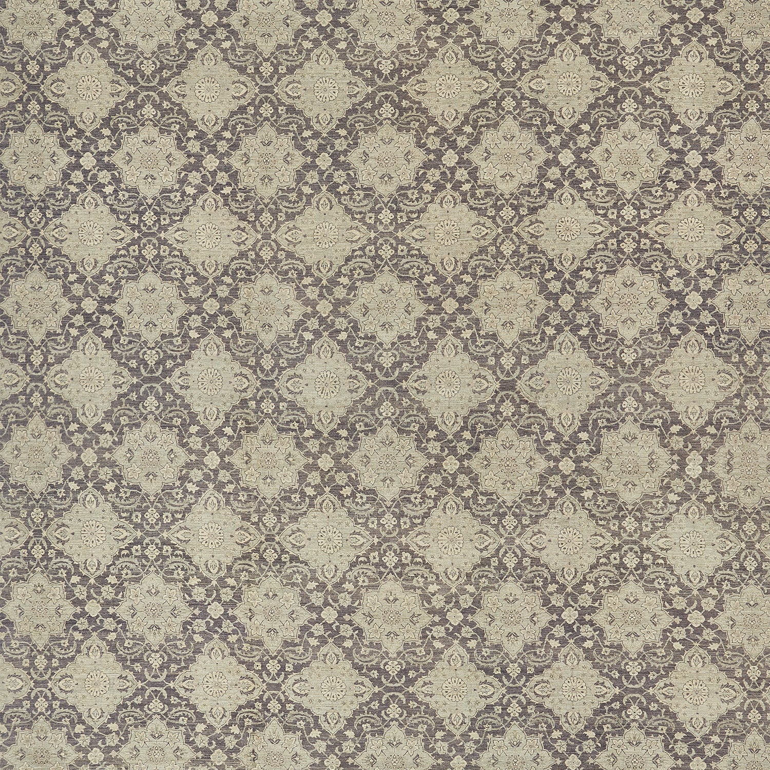 An intricate, symmetrical floral pattern in vintage beige and gray.