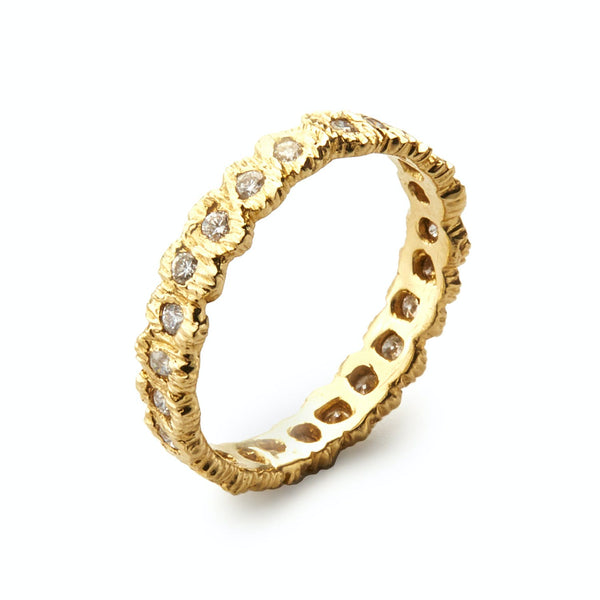 Gold ring with clear gemstones in textured setting style