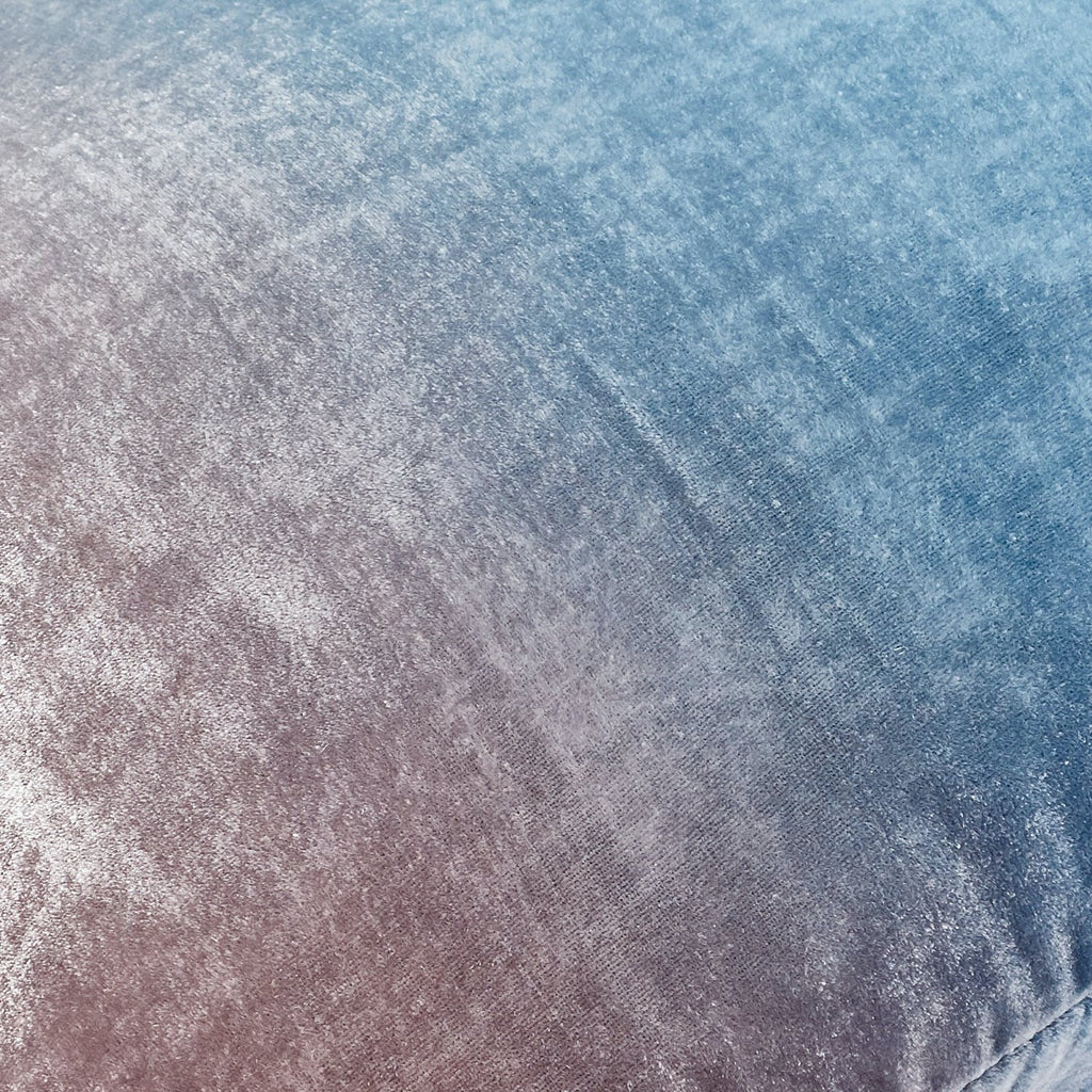 Abstract, icy surface displaying color gradient from deep blue to lavender