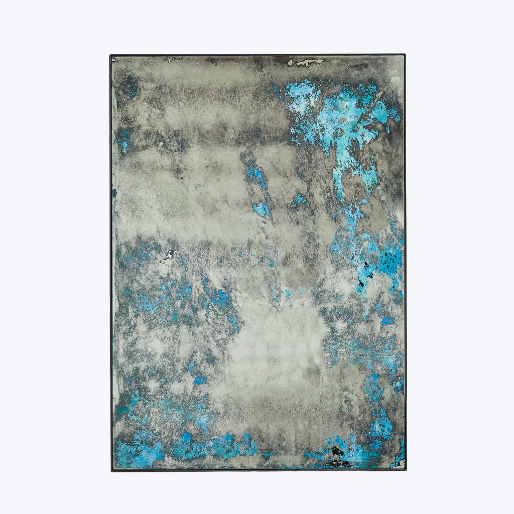 Abstract rectangular artwork with vibrant blue splashes on textured background.
