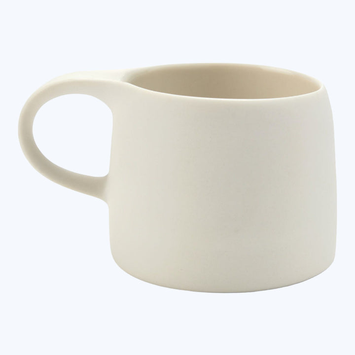 Simple off-white ceramic mug with a single handle