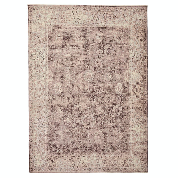 Intricate floral motifs adorn a vintage rectangular area rug.