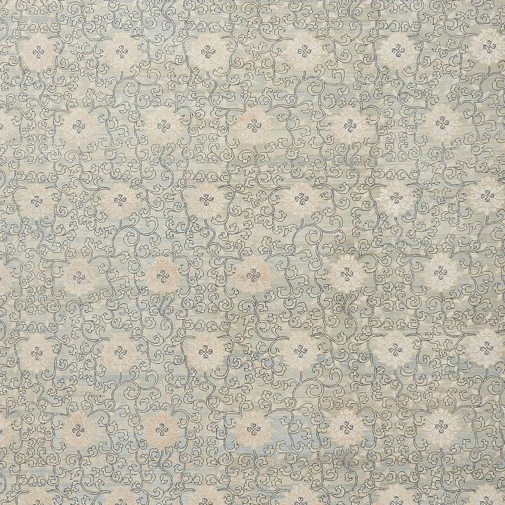 An elegant vintage patterned fabric with intricate swirls and foliage.