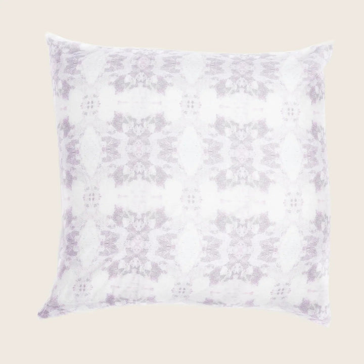 Soft purple and white square pillow with a symmetrical pattern