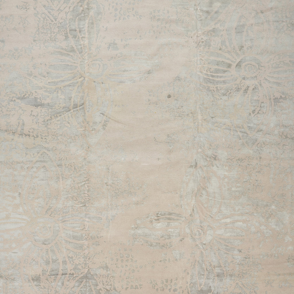 Vintage-inspired faded damask fabric with intricate floral motifs