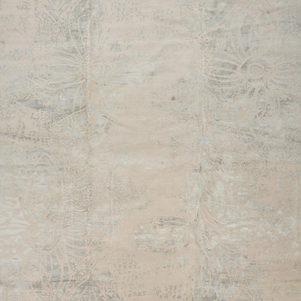 Vintage-inspired faded damask fabric with intricate floral motifs