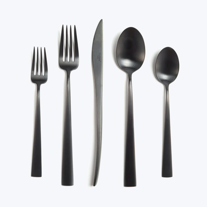 Modern minimalist cutlery set with black handles and metallic finish