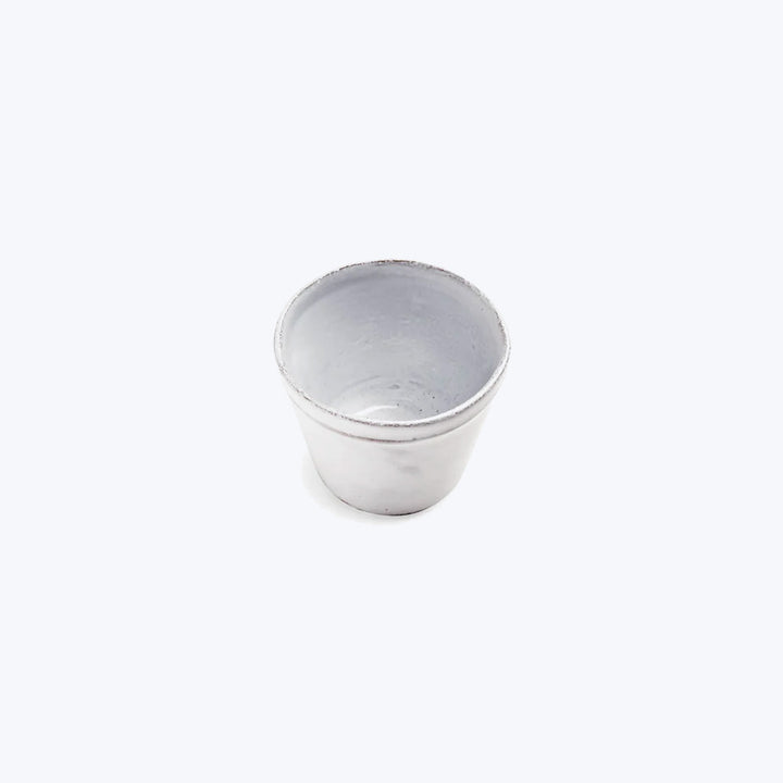 Single empty aluminum cup against white background, reflective and lightweight.