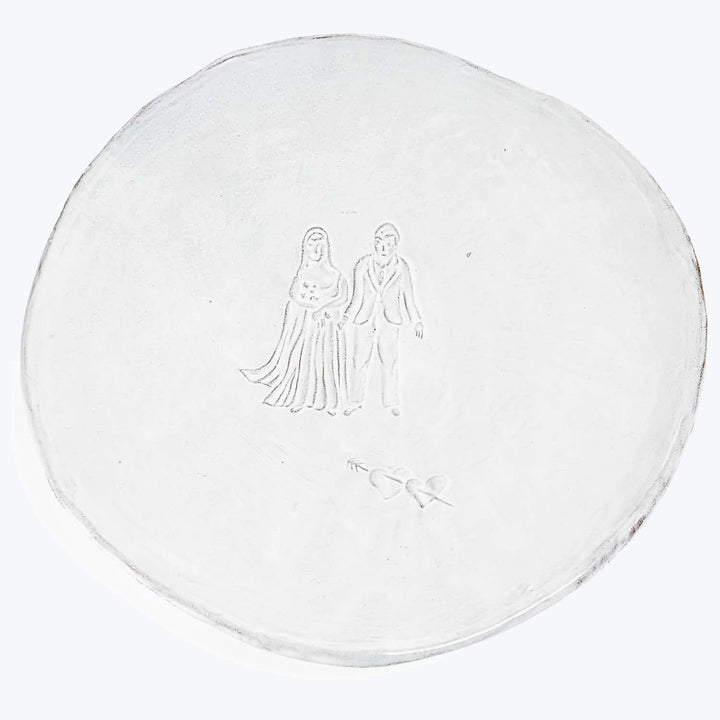 Decorative wedding plate with bride and groom figures, elegant design.