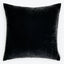 Square black velvet pillow with raised border and tag.