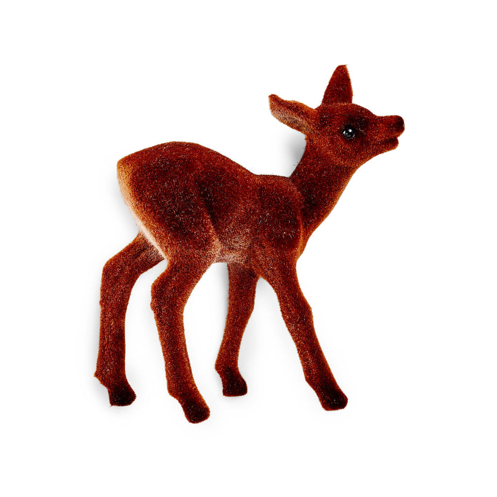 Small flocked deer figurine with lifelike posture on white background.