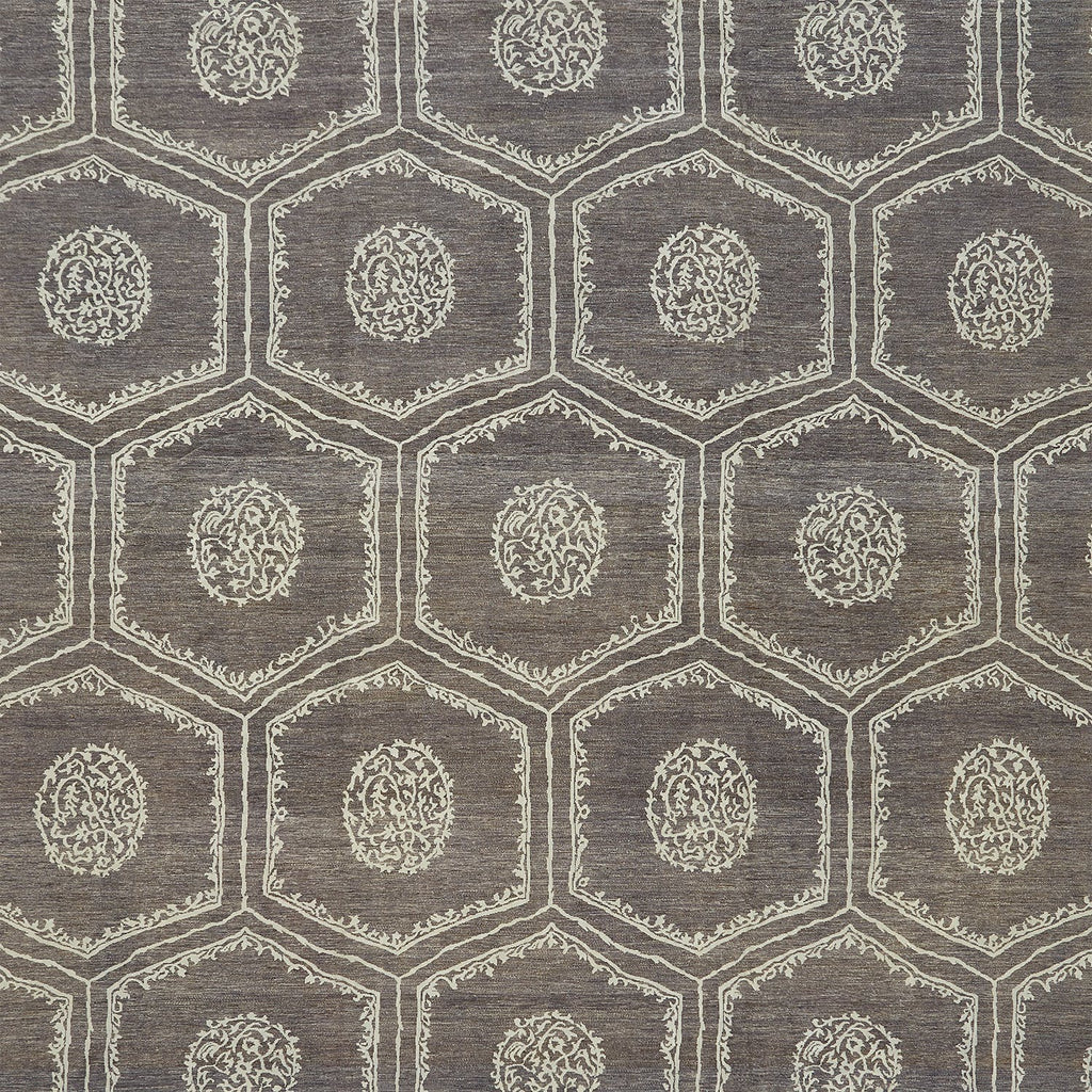 Close-up of a geometric patterned fabric with floral motifs.