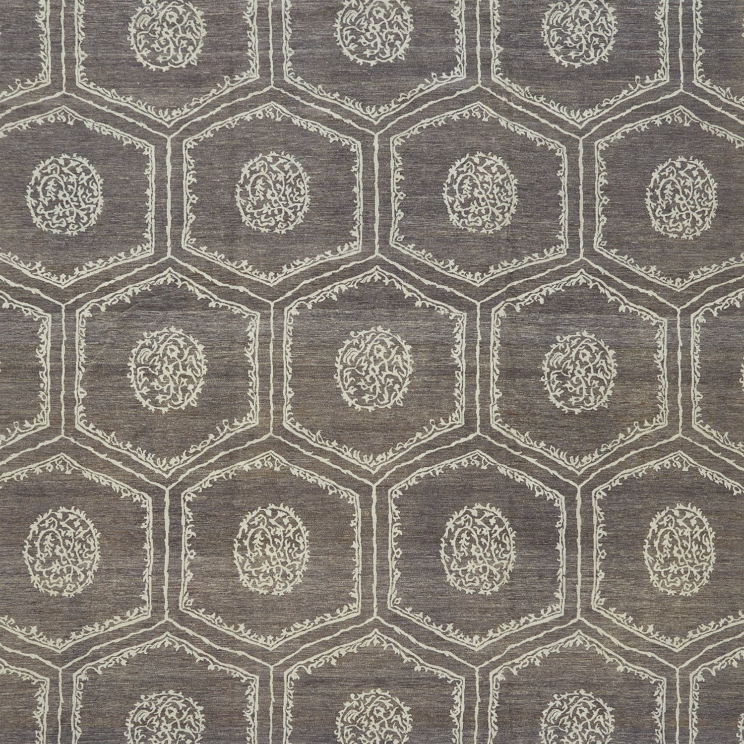 Close-up of a geometric patterned fabric with floral motifs.