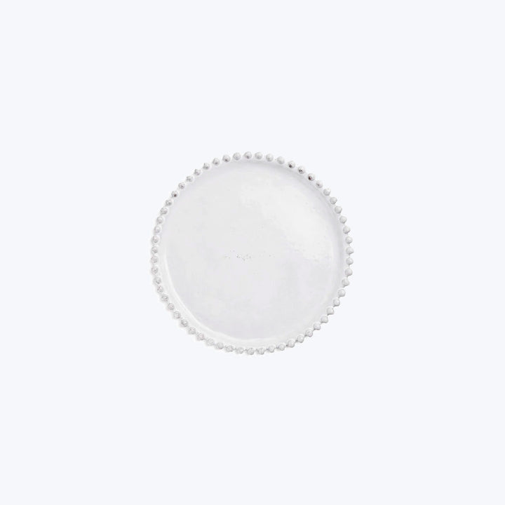 Translucent circular object with bead-like protrusions, minimalistic design.