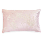 Rectangular pillow with pale pink cover and sparkling embellishments.