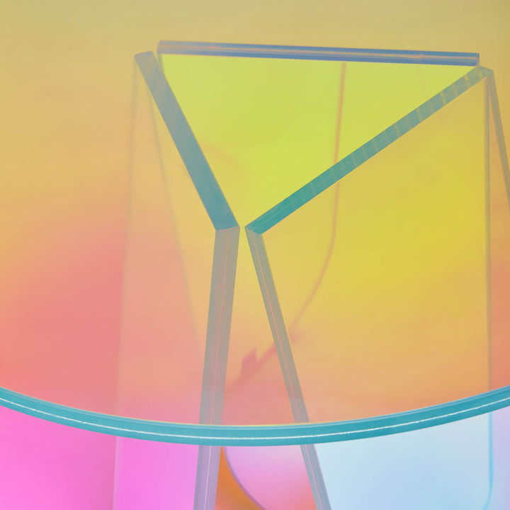 Translucent glass object with colorful overlays in abstract geometric structure