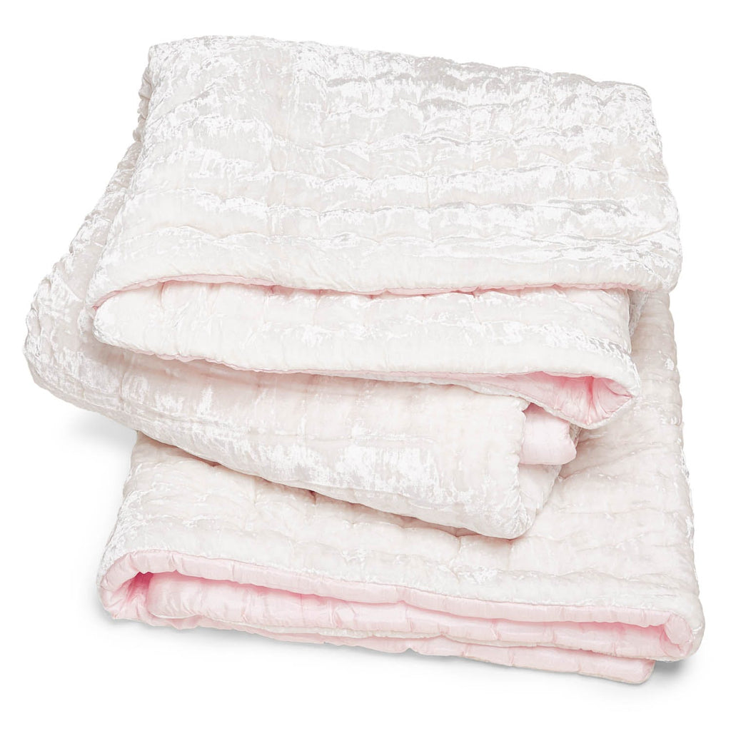 Soft and cozy plush blanket with delicate textured pattern.
