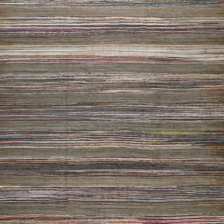 An intricately textured pattern with varied earthy tones and stripes.
