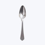 Single stainless steel spoon on white background, minimalist design, polished