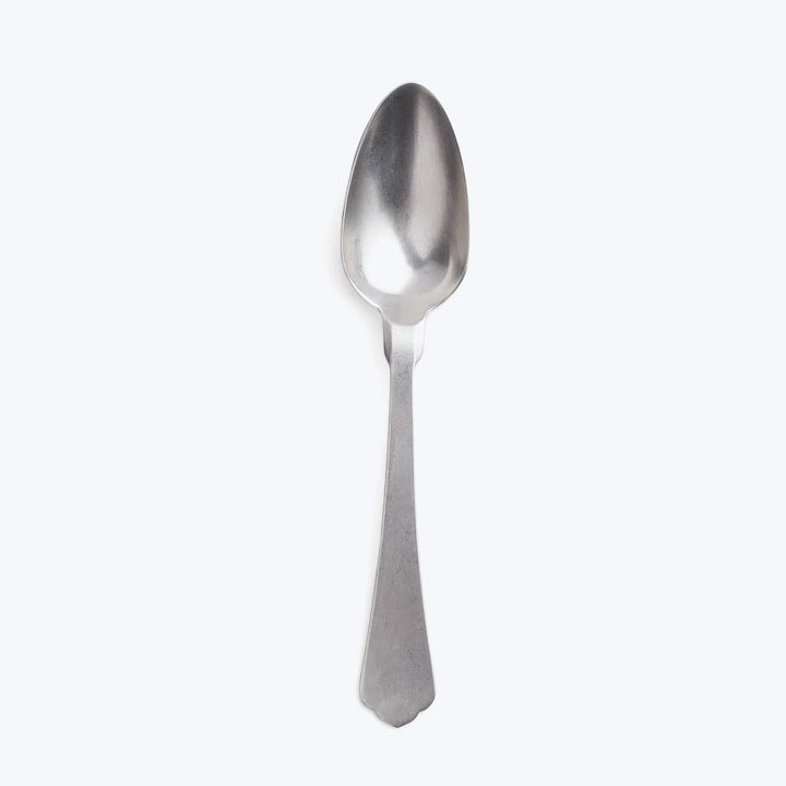 Simple stainless steel spoon on white background, classic design.