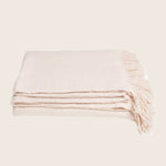 Soft and cozy throw blanket with fringe detail adds warmth.