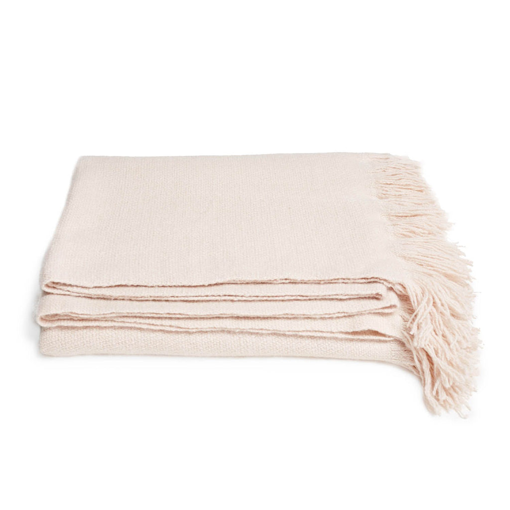 Soft and cozy throw blanket with fringe detail adds warmth.