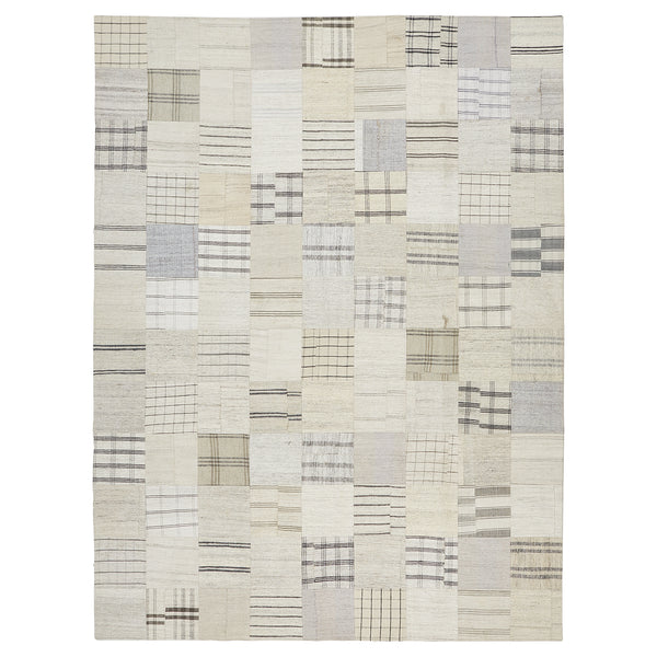 Contemporary geometric area rug with neutral color palette and dynamic design.