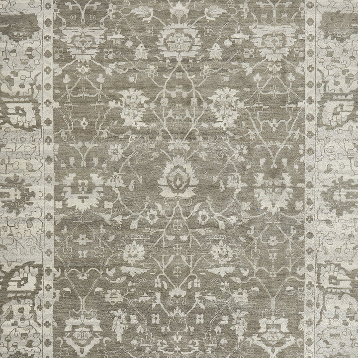 Close-up of a symmetrical, intricate rug with floral and geometric motifs.