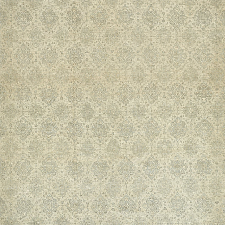 Close-up of intricately detailed diamond-shaped motifs on vintage fabric.