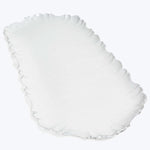 Elegant glass dish with scalloped edge design on white background.