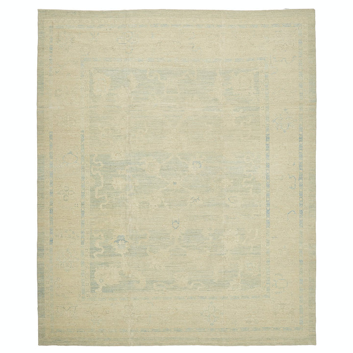 Vintage rug with faded design and neutral color palette.