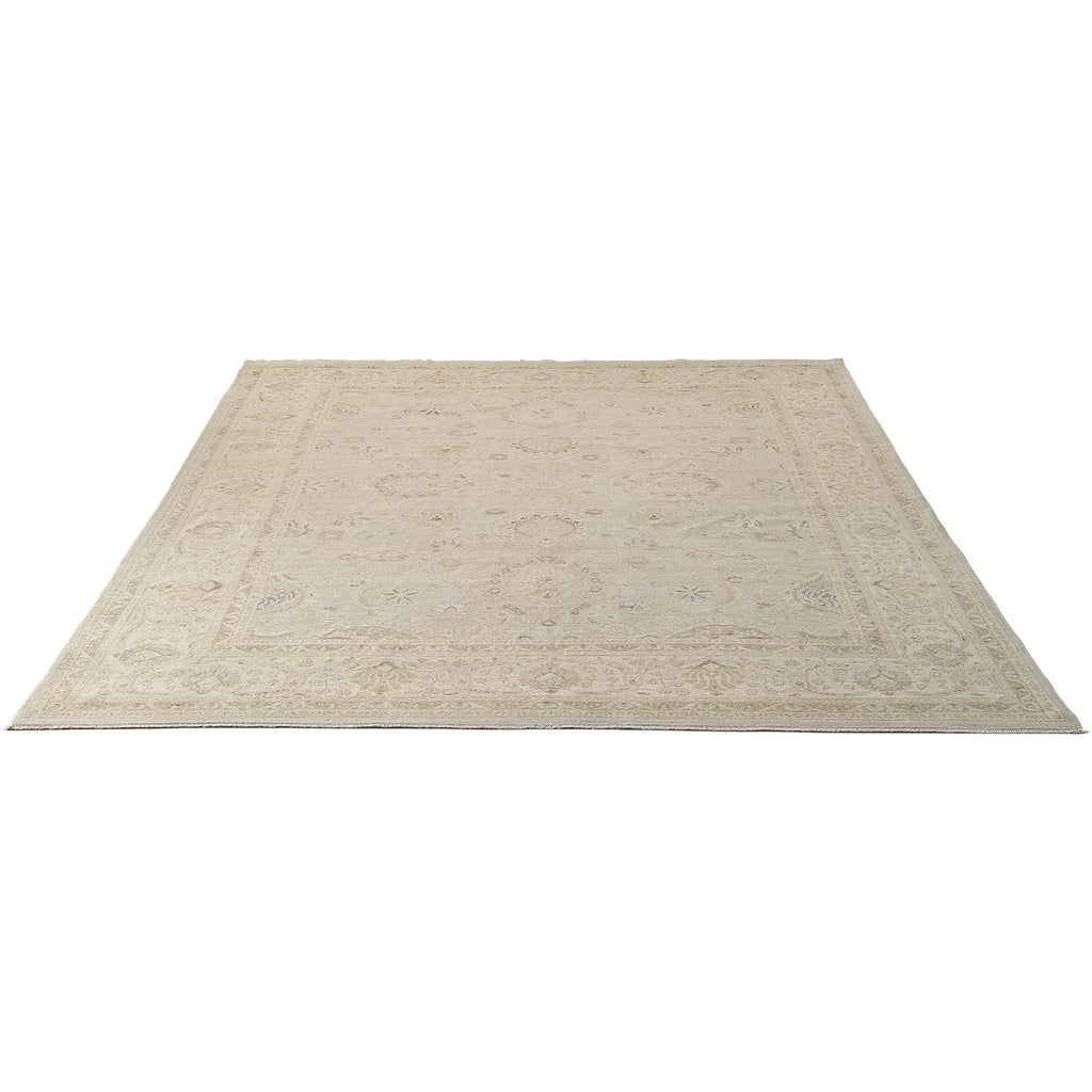 Classic-style rectangular area rug with a neutral, ornamental design.