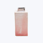 Vintage ceramic vase with a mottled pinkish glaze and wear