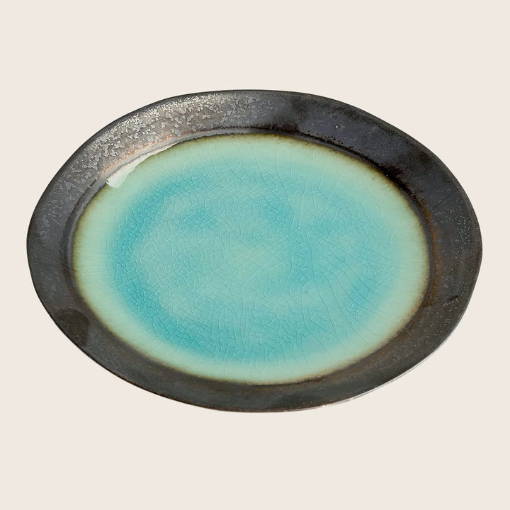 Handcrafted ceramic plate with crackle glaze finish in turquoise and brown.