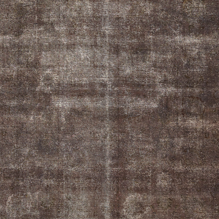 Faded and worn antique fabric with a rustic, textured appearance.