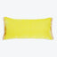 Vibrant yellow rectangular pillow with textured fabric and fringe trim.